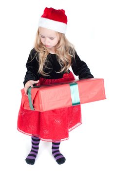 Beautiful baby girl dressed up for Christmas isolated in white