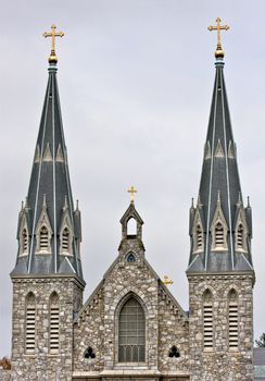 An old brick church with large steeples