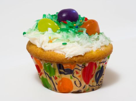 Cupcake with white icing and jelly beans
