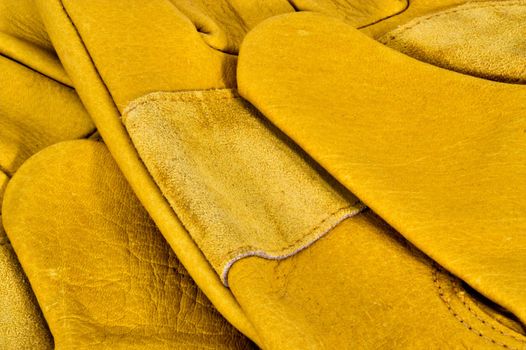 Closeup of yellow leather work gloves