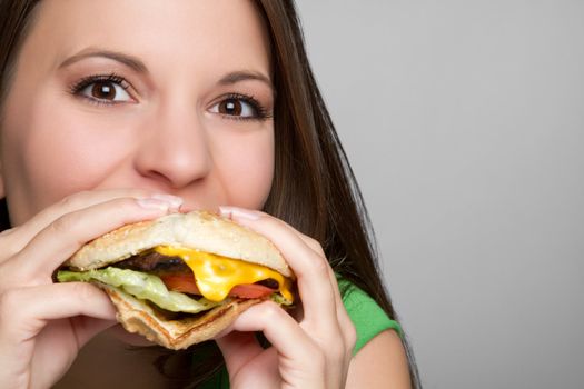 Beautiful girl eating hamburger food