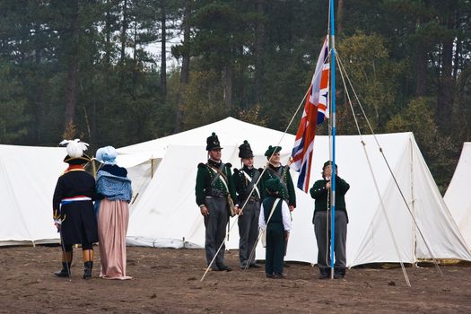 AUSTERLITZ, THE NETHERLANDS, OCTOBER 12, 2008 � History enthusiasts take part in the replay of the inspection of the troops by Louis Napol�on , king of Holland from 1806-1810. Hoist the flag