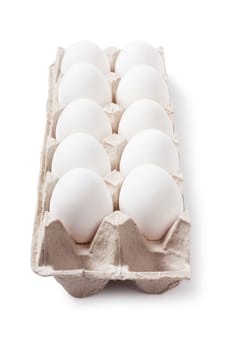 White eggs in carton. Nutritious eating.