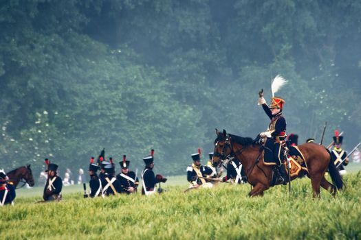 WATERLOO, BELGIUM, JUNE 21, 2009 - History enthusiasts from 24 countries  take part in the re-enactment of the battle of Waterloo that in 1815 ended Napoleon's imperial dream. Cavalryman signs