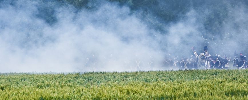 WATERLOO, BELGIUM, JUNE 21, 2009 - History enthusiasts from 24 countries  take part in the re-enactment of the battle of Waterloo that in 1815 ended Napoleon's imperial dream. Hide in canon smoke