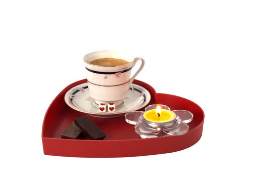 Romantic breakfast with chocolate on red heart shaped tray