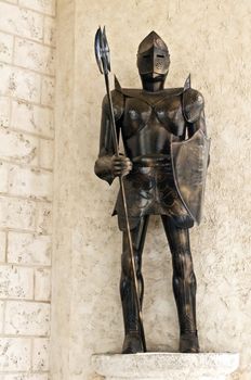 Image of a standing medieval knight armor.