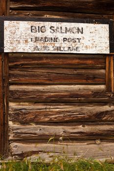 Historic Big Salmon Trading Post, Sign on ruin of log cabin with little chipmunk