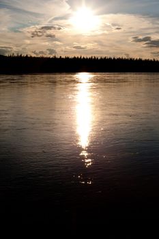 Sunset over boreal forest at Yukon River, Canada