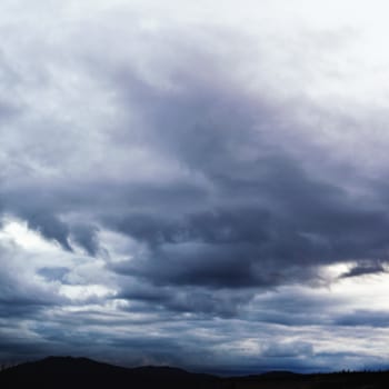 Dark clouds brewing before rain.