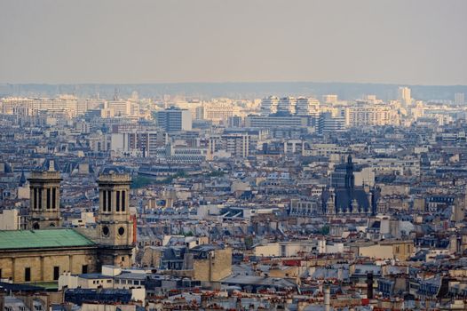 Aerial panorama above houses rooftops in a Paris