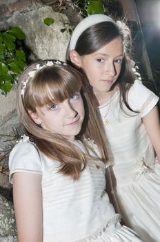 girls white dress the day of their first communion
