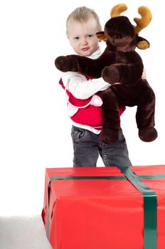 Shot of christmas toddler with presents isolated on white