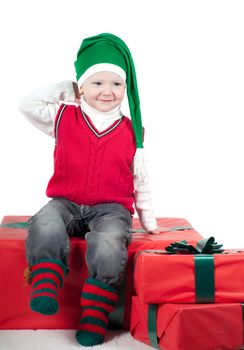 Shot of christmas toddler with presents isolated on white