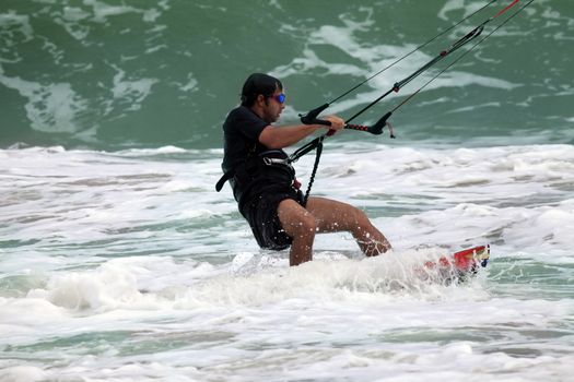 Kiteboarder enjoy surfing in ocean. Vietnam