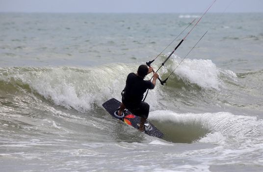 Kiteboarder enjoy surfing in water. Vietnam