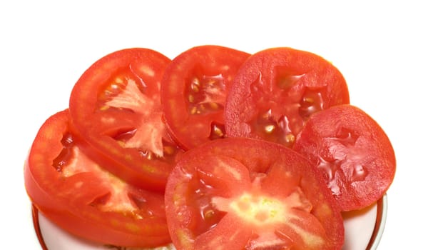 Tomato slices on a plate isolated on a white background.