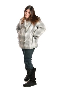 Full length view of a teenage girl posing and showing attitude, isolated against a white background