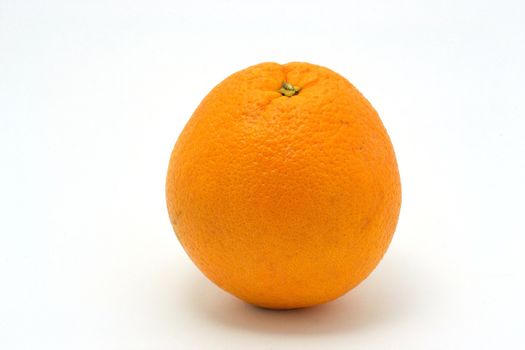 The single orange over the white background
