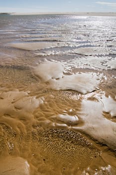 View of the shoreline of a beautiful beach on the Algarve, Portugal.