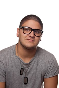 A young teenage man isolated over white wearing black frame nerd glasses and military style dog tags.