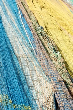 Trawl fishing nets drying on a pier