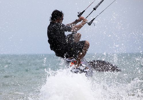 Kiteboarder enjoy surfing in water. Vietnam