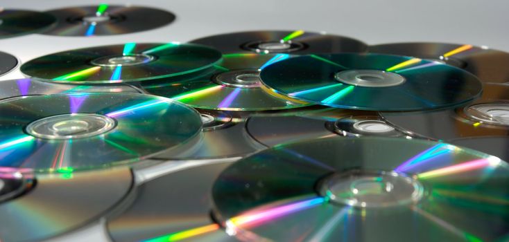 A pile of dirty CDs