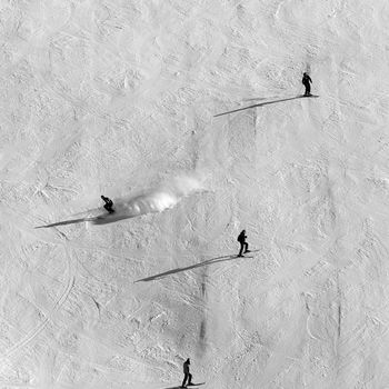 Skiers on the track