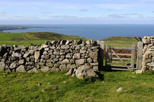 View across farmland on the northern coast of the Llyn Peninsula Wales