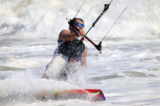 Kiteboarder enjoy surfing in water. Vietnam