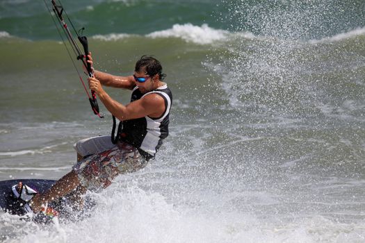 Kiteboarder enjoy surfing in water. Vietnam