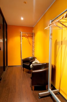Shot of wardrobe room with two armchairs