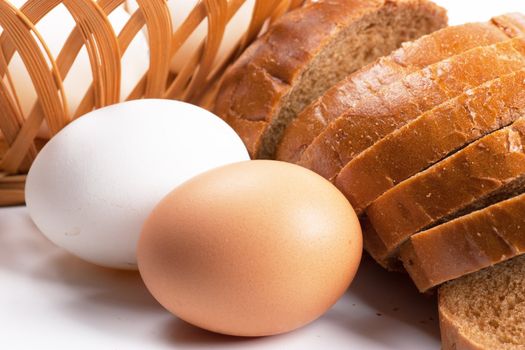 Close-up view of a pair of eggs and sliced bread