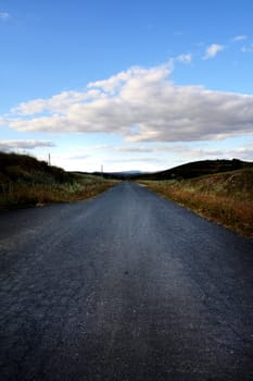 View of a asphalt road on the countryside region of Algarve.