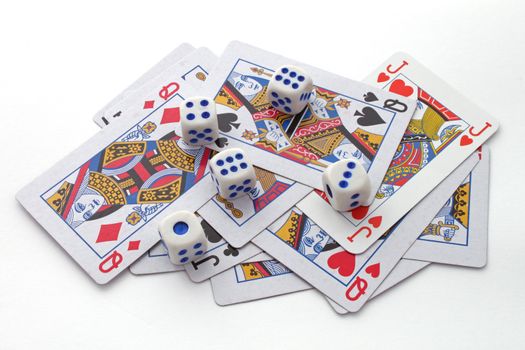 Gambling with playing cards and dice over a white background.