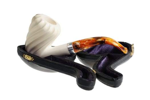 Tobacco pipe from meerschaum on a stand. Isolated on white.