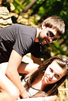 Young happy couple on the field. Shoot on the nature.