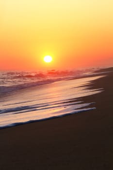 Beautiful sunset on a beach in the Algarve, Portugal.