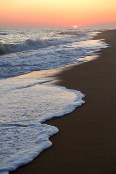 Beautiful sunset on a beach in the Algarve, Portugal.