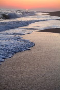 Beautiful sunset on a beach in the Algarve, Portugal.