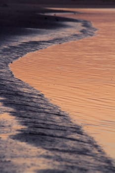 Beautiful sunset on a beach in the Algarve, Portugal.