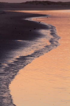 Beautiful sunset on a beach in the Algarve, Portugal.