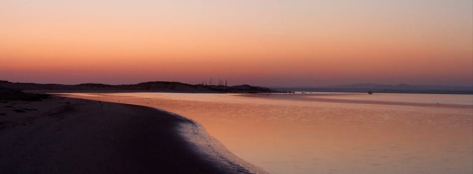 Beautiful sunset on a beach in the Algarve, Portugal.