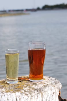 beer and cider by riverbank