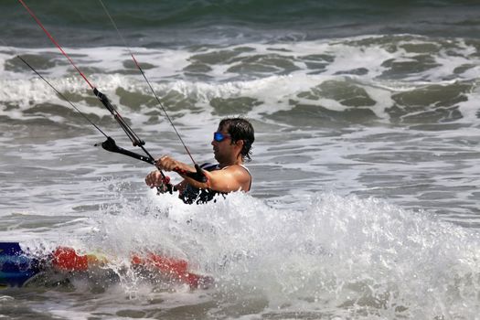 Kiteboarder enjoy surfing in water. Vietnam