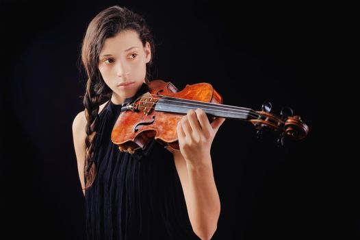 Musician playing violin. Isolated on the black background