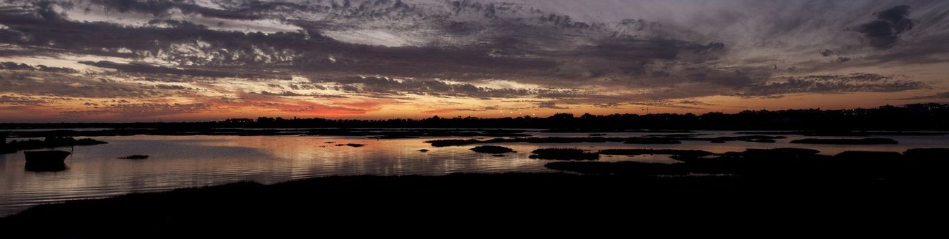 View of a beautiful sunset on the Ria Formosa region on the Algarve, Portugal.
