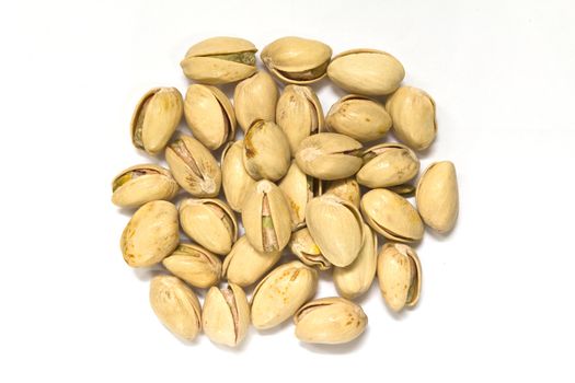 closeup image of pistachios on white background