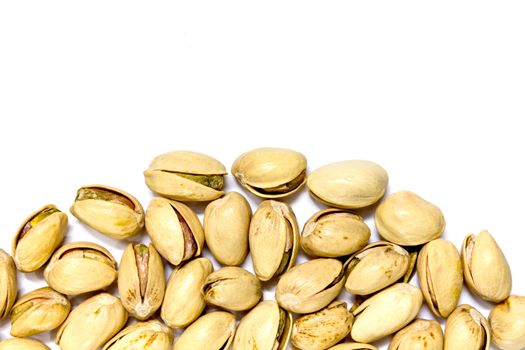 closeup image of pistachios on white background